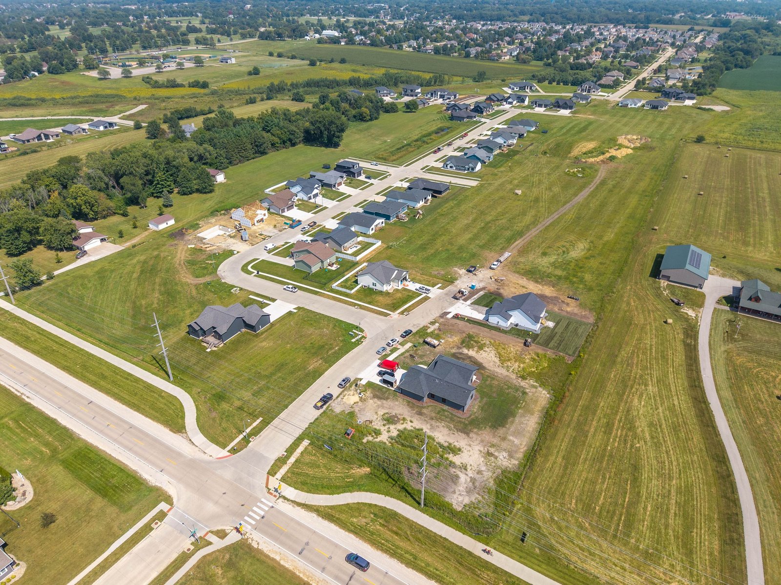 Aerial view of the West Fork Crossing entrance, streets and homes in Cedar Falls, Iowa